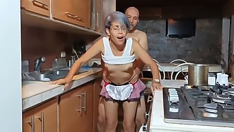 Intimate Encounter With Stepmom In The Kitchen While Her Husband Is Nearby